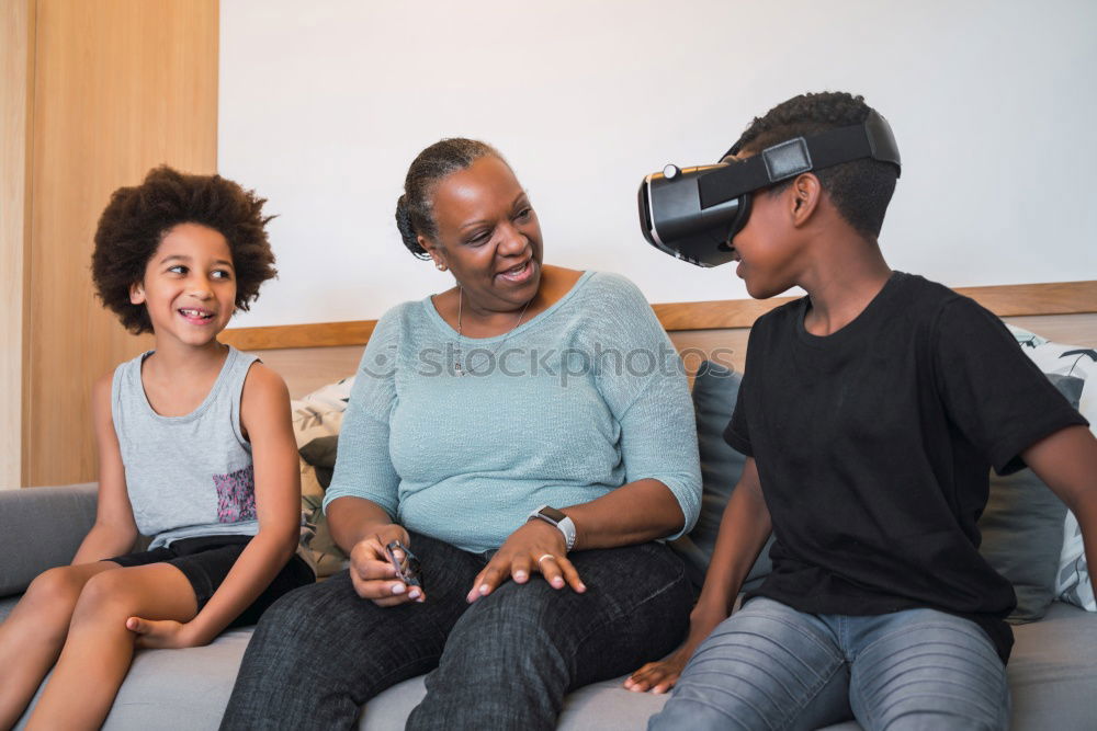 Similar – Image, Stock Photo Father and son playing with VR glasses.