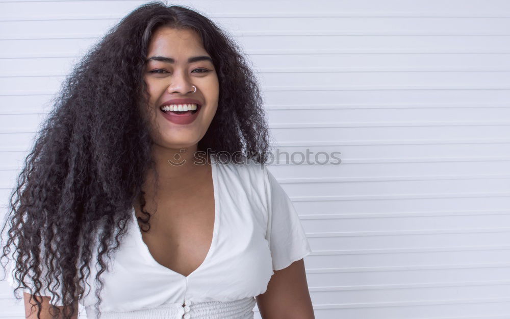 Similar – Smiling young Arab woman with black curly hairstyle