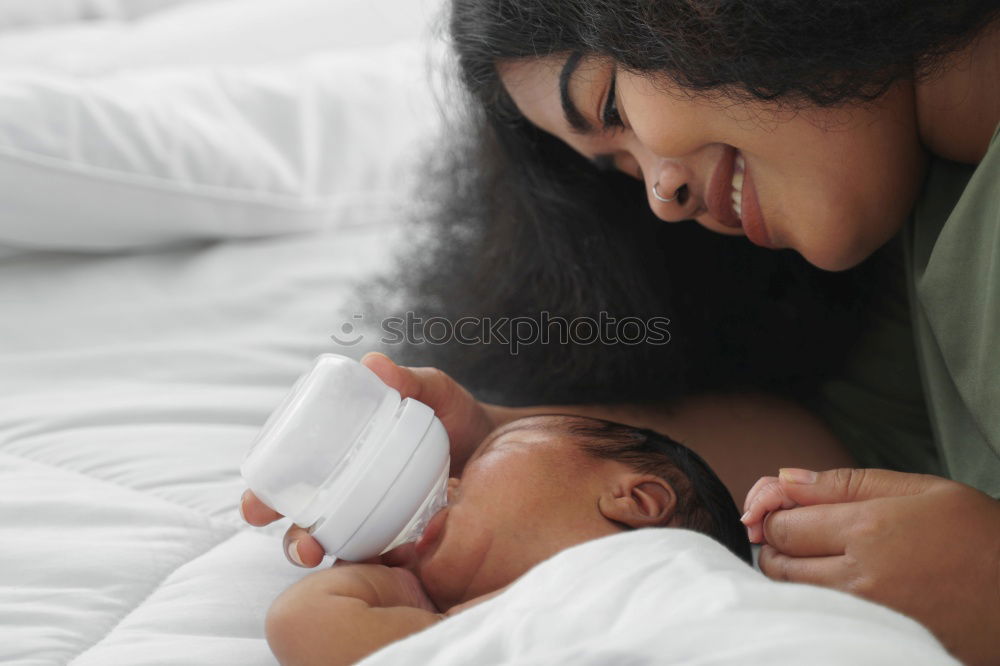 Similar – Image, Stock Photo African american mother giving daughter a kiss on cheek