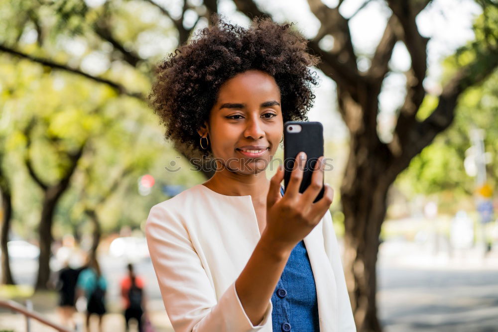 Similar – Front view of a young smiling african american woman standing