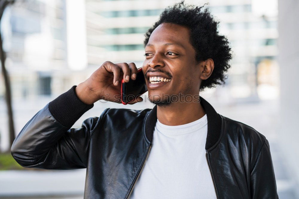 Similar – Image, Stock Photo Portrait of handsome afro man using his mobile.