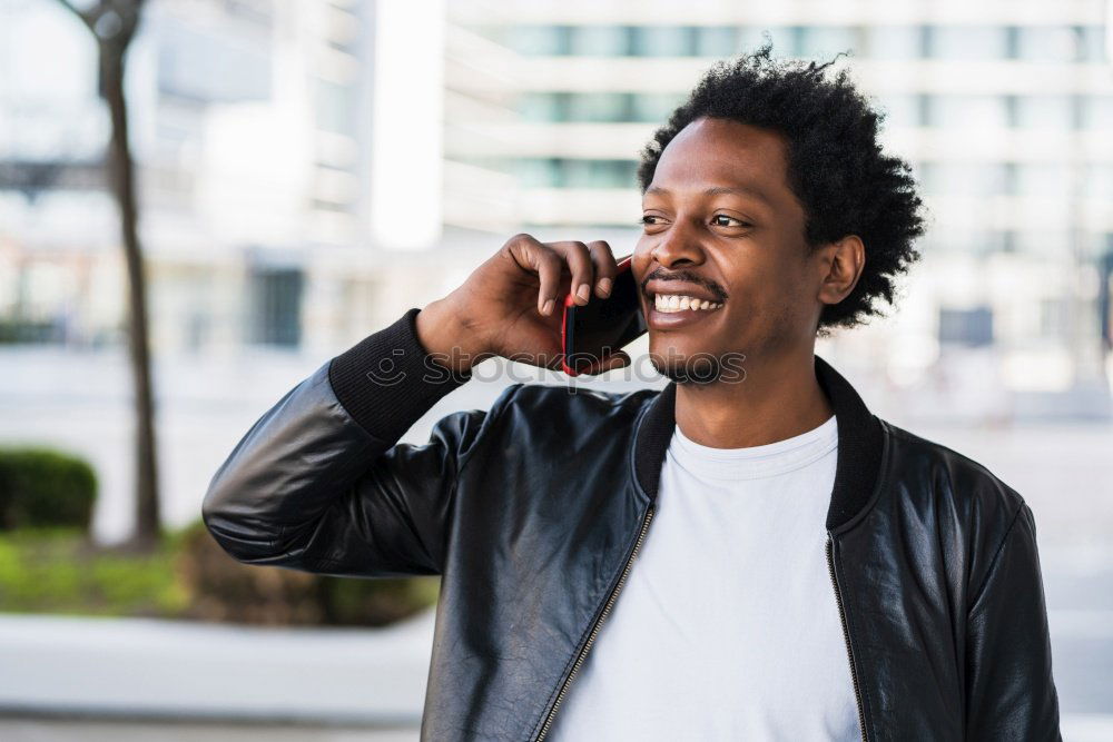 Similar – Afro young man using mobile phone and fixed gear bicycle.