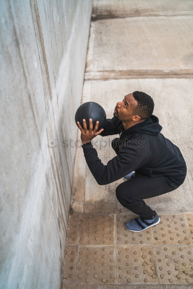 Similar – Image, Stock Photo Black man doing stretching after running outdoors