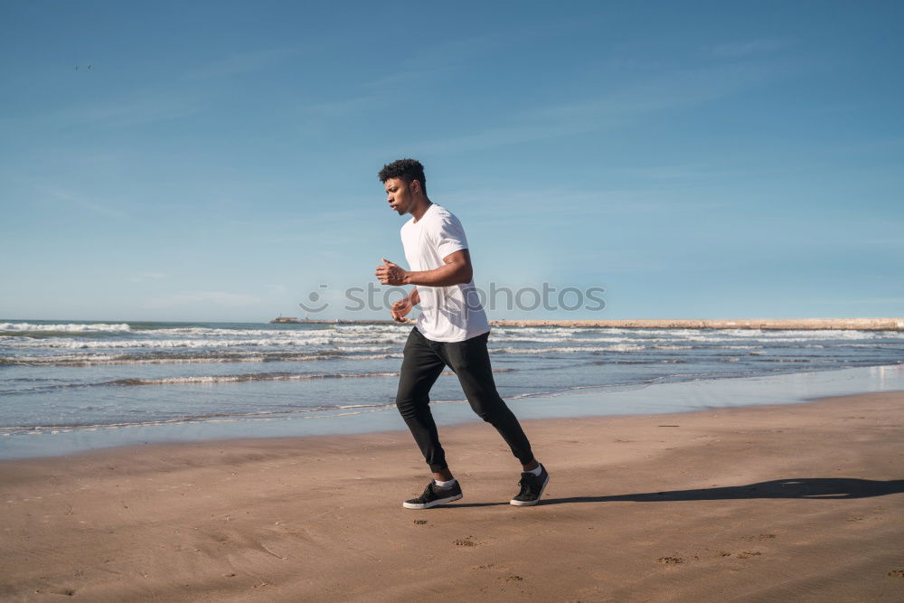 Similar – Image, Stock Photo tough muscular man is doing stretching at railing to beach