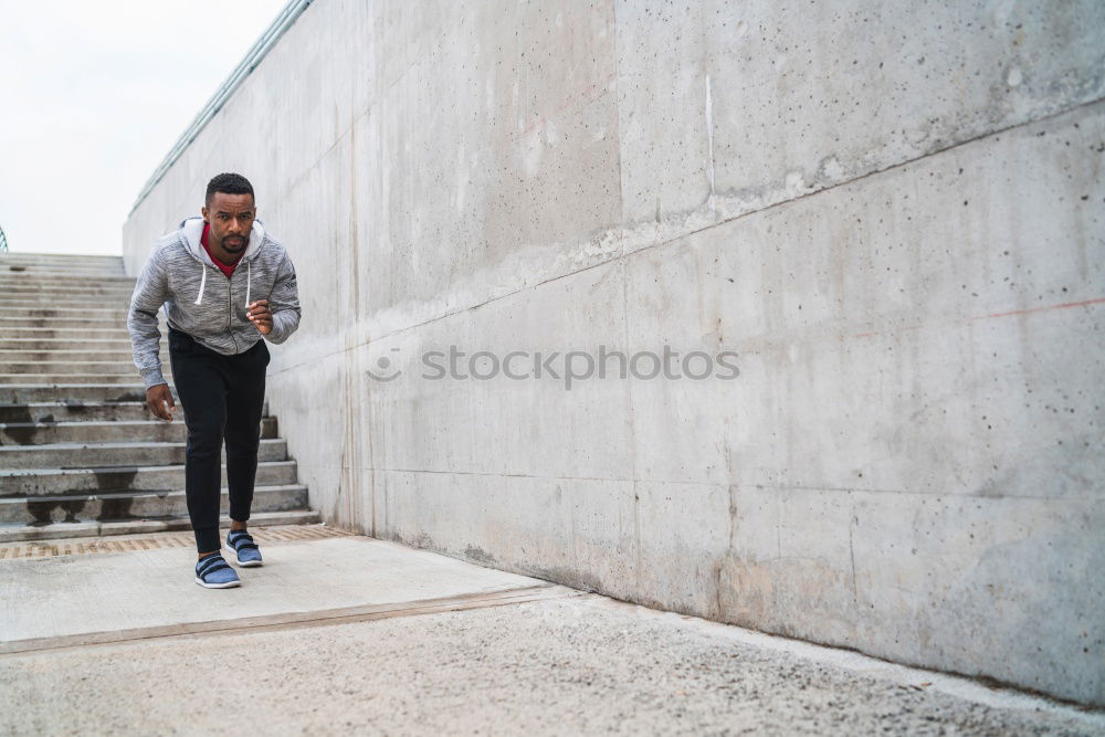 Similar – Image, Stock Photo Black man doing stretching after running outdoors
