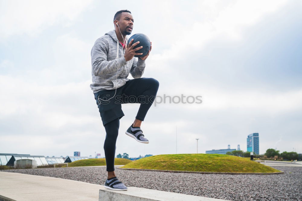 Similar – Black man running outdoors in urban road