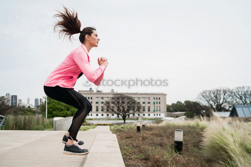 Similar – Young Woman working out outdoors and having fun