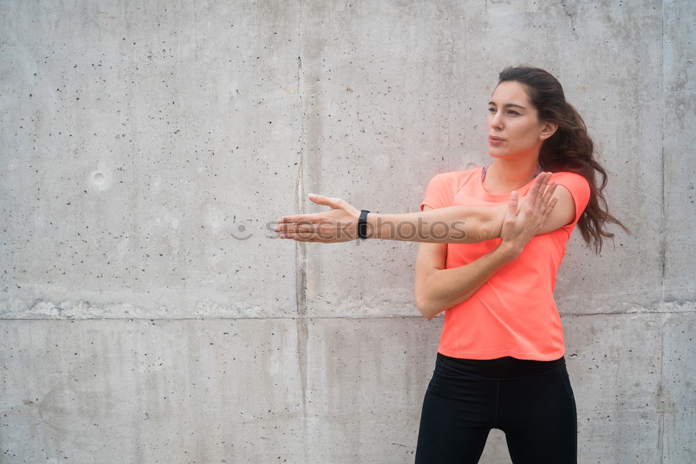 Similar – Woman tying hair in ponytail getting ready for run.