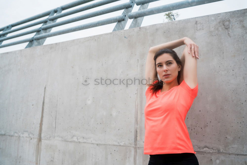 Similar – Woman tying hair in ponytail getting ready for run.