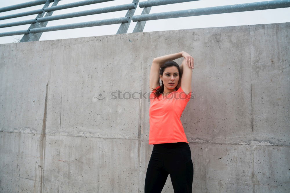 Similar – athletic woman doing her stretching routine