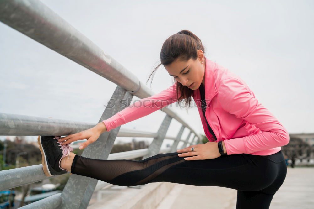 Similar – Young black woman doing stretching after running outdoors