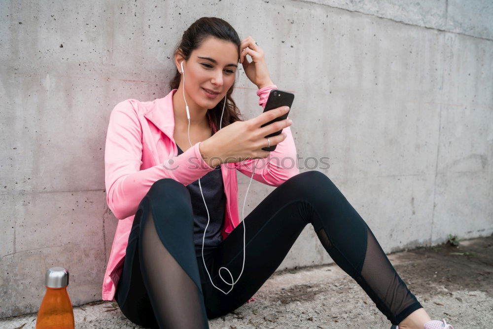 Similar – Image, Stock Photo Sporty young woman sitting on forecourt with her mobile