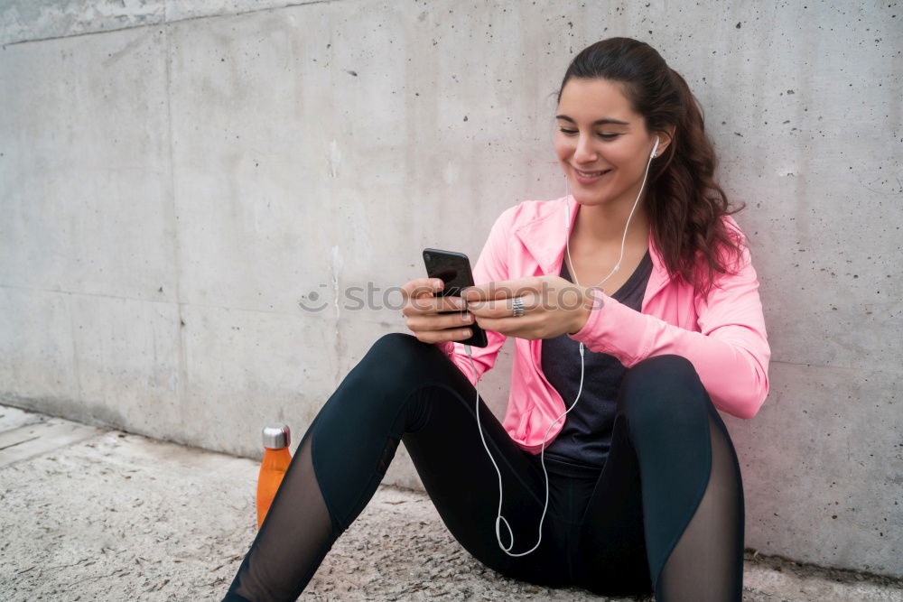 Image, Stock Photo Sporty young woman sitting on forecourt with her mobile