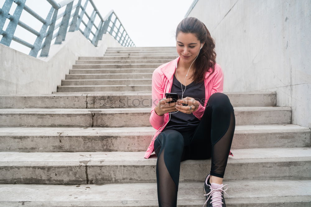 Similar – Image, Stock Photo Sporty young woman sitting on forecourt with her mobile