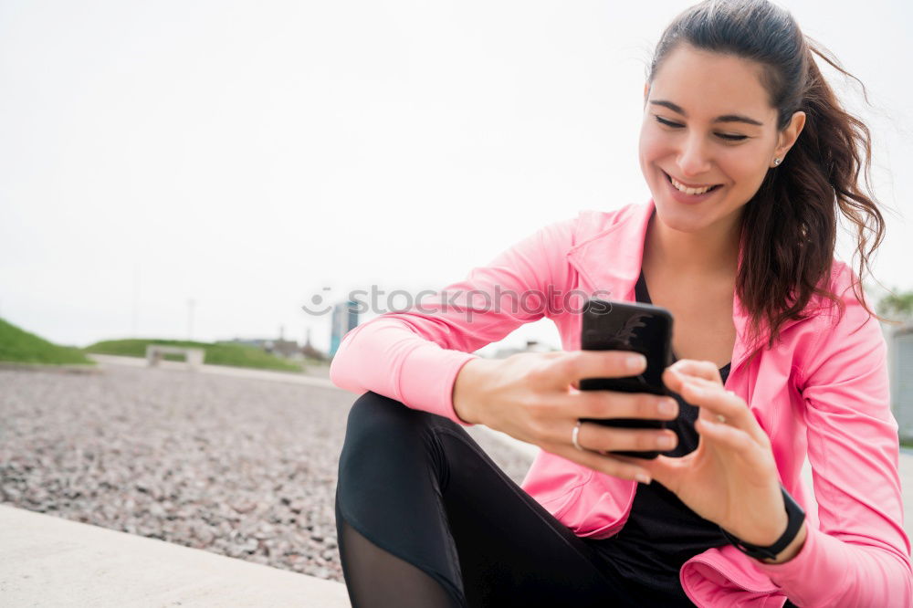 Similar – Image, Stock Photo Sporty young woman sitting on forecourt with her mobile