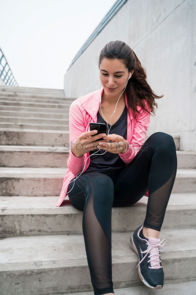 Similar – Image, Stock Photo Sporty young woman sitting on forecourt with her mobile