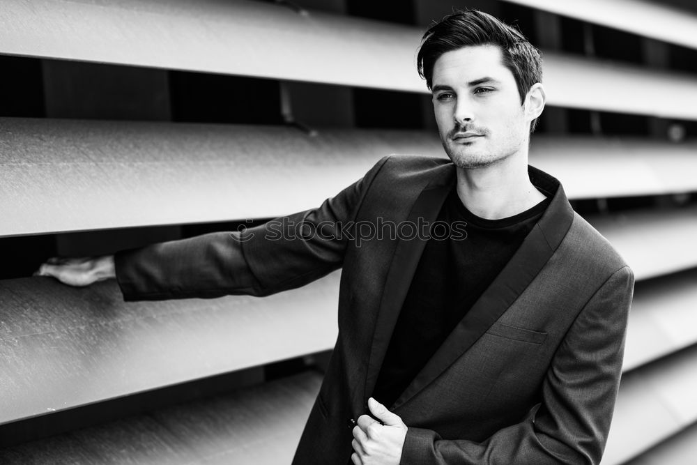 Similar – Image, Stock Photo Young handsome man over a dark brick wall