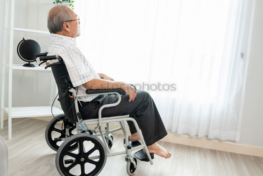 Similar – Senior woman sitting in wheelchair in hospital