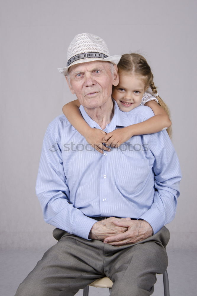 Similar – Portrait of grandfather and grandson embracing