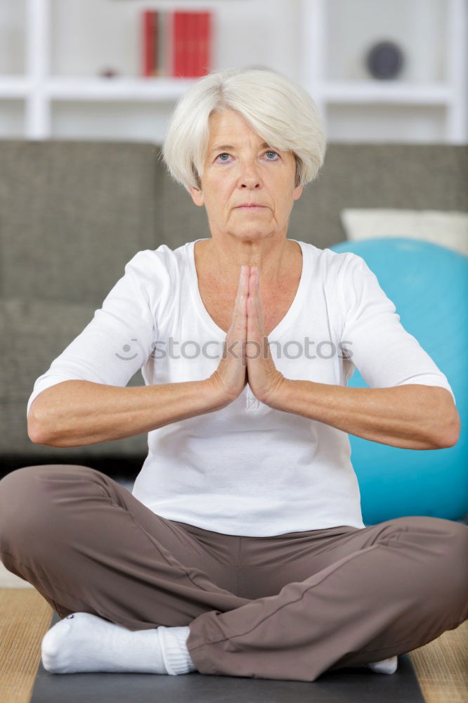 Similar – Image, Stock Photo blonde woman sitting in the grass and stretching in a park