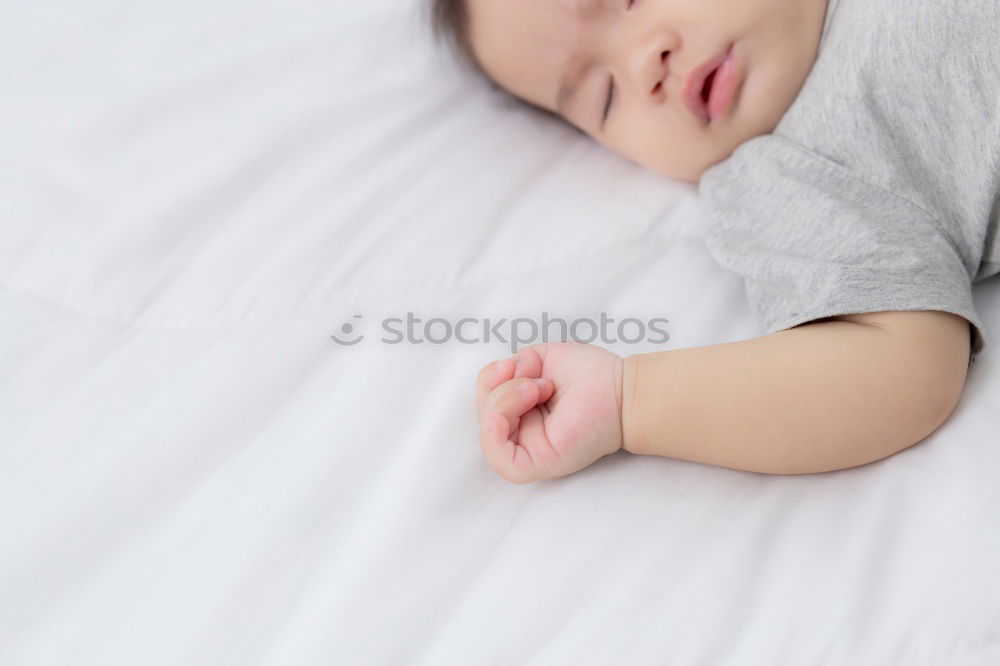 Similar – Image, Stock Photo Newborn baby girl sleeping on blue sheets at home