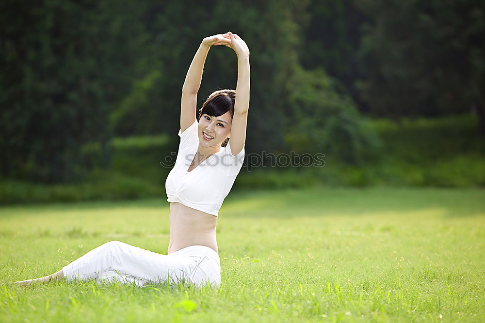 Similar – Image, Stock Photo Young woman doing yoga in nature.