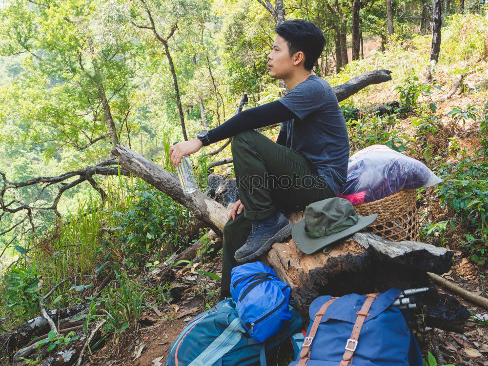 Similar – Image, Stock Photo Couple pausing while doing trekking