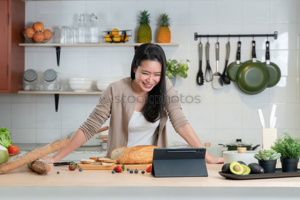 Similar – Image, Stock Photo Happy contented housewife in her kitchen