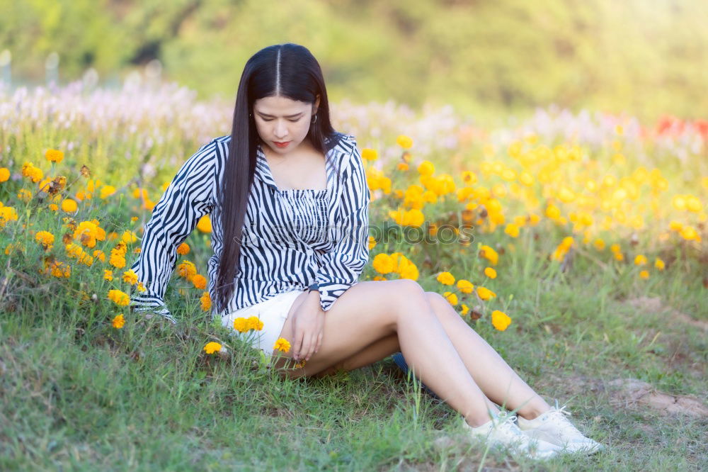 Similar – Image, Stock Photo sports woman doing lawn exercises and stretching on the grass outdoor in a park listening music