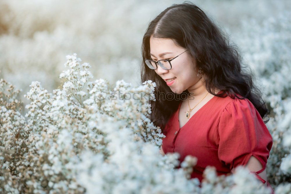 Similar – A young woman looking at a tree.