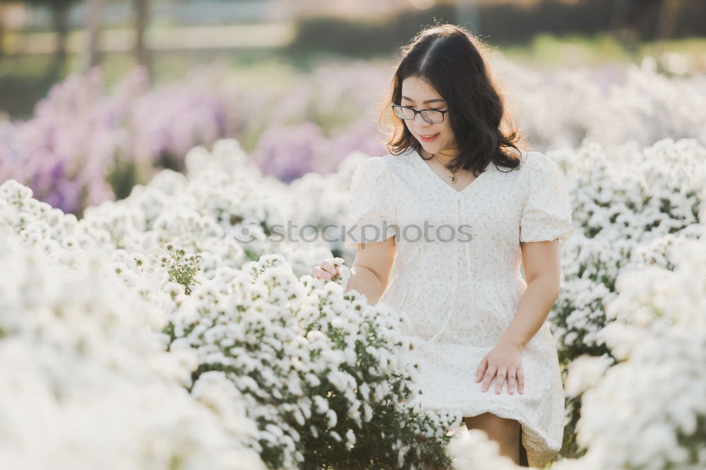 Similar – Happy young black woman surrounded by flowers