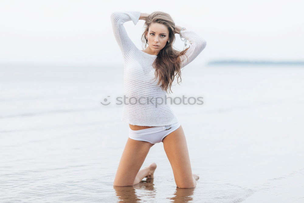 Similar – Image, Stock Photo Young woman doing yoga in the beach