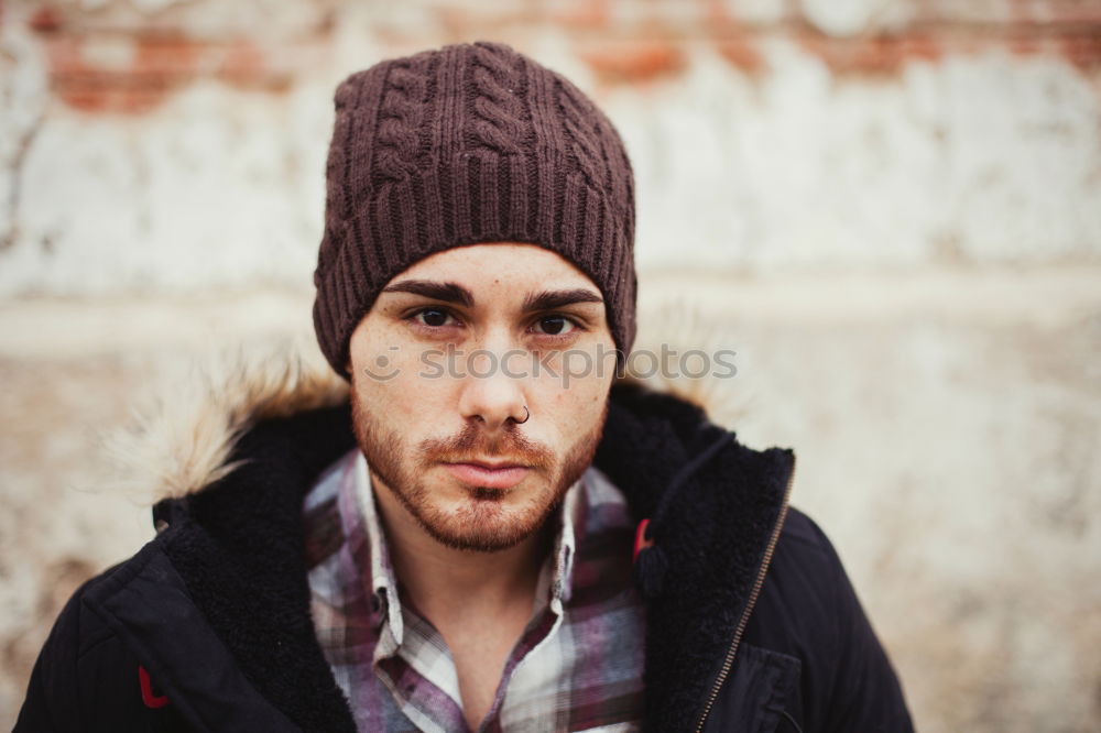 Similar – Thoughtful young man sitting on an urban bench