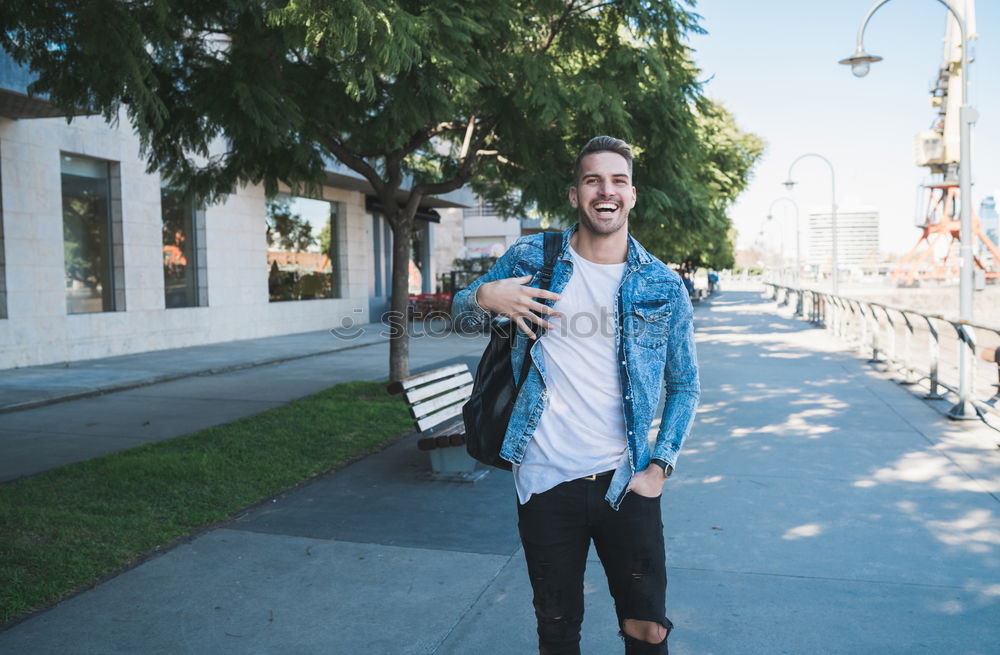 Similar – A long hair male running between the trees during a sunny day in the park with copy space