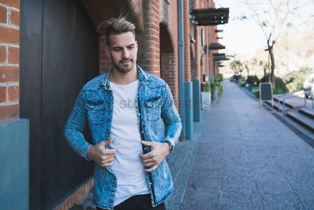 Similar – Image, Stock Photo young handsome man with t-shirt against a wall in street