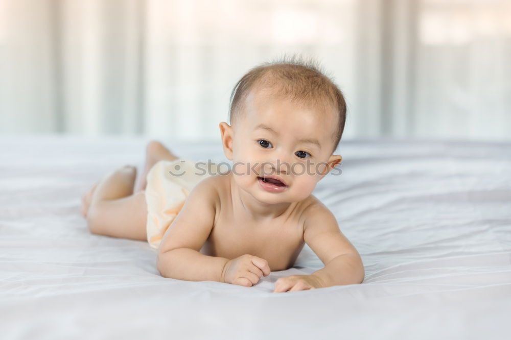 Similar – Cute Baby Girl Lying in the Crib