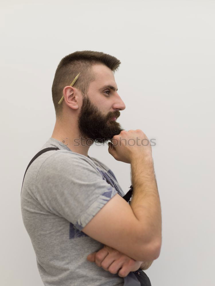 Similar – Bearded man sitting on dumpster