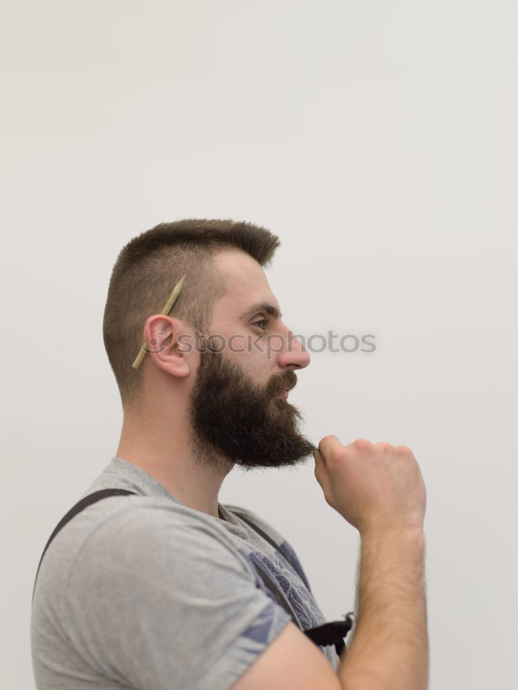 Similar – Bearded man sitting on dumpster