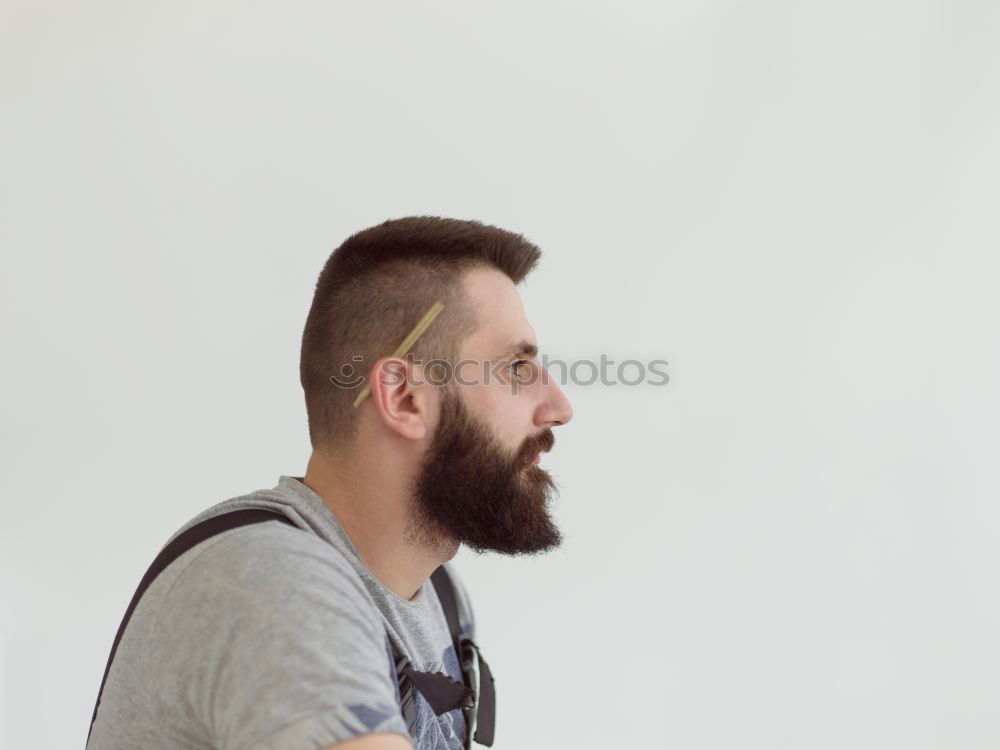 Similar – Bearded man sitting on dumpster