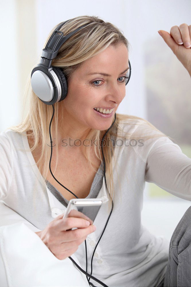 Similar – Image, Stock Photo Young blonde girl using a smartphone while sitting