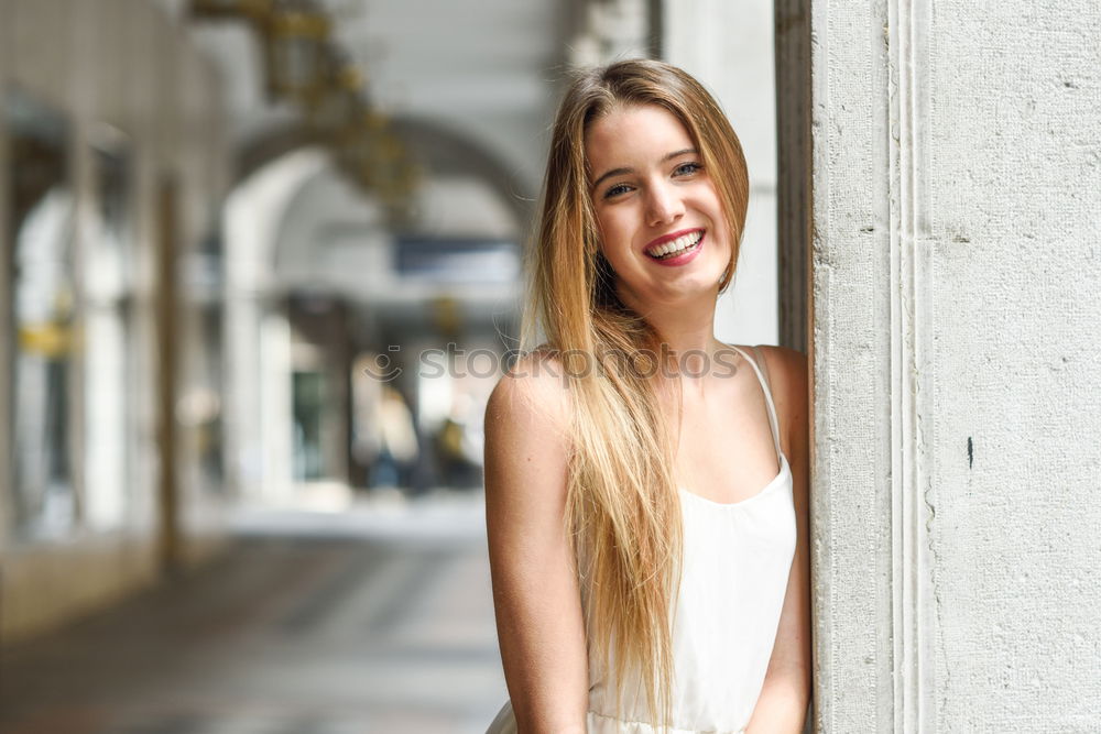 Similar – Smiling young woman in urban background.