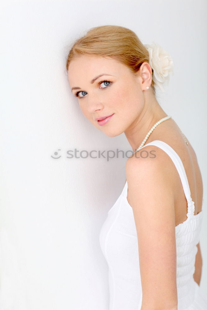 Similar – Image, Stock Photo young redheaded woman stands in front of a white door and smiles