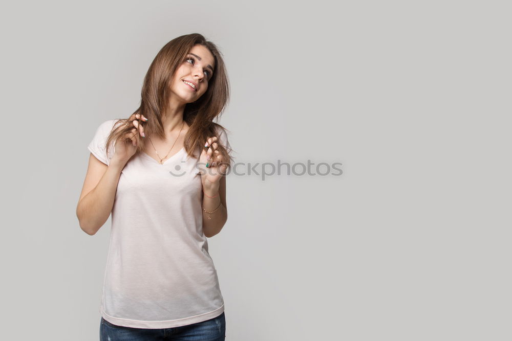 Similar – Who am I? Young woman holding a mirror in front of her face. Faceless, identity not recognizable, the mirror is showing her backhead. Hiding her face.