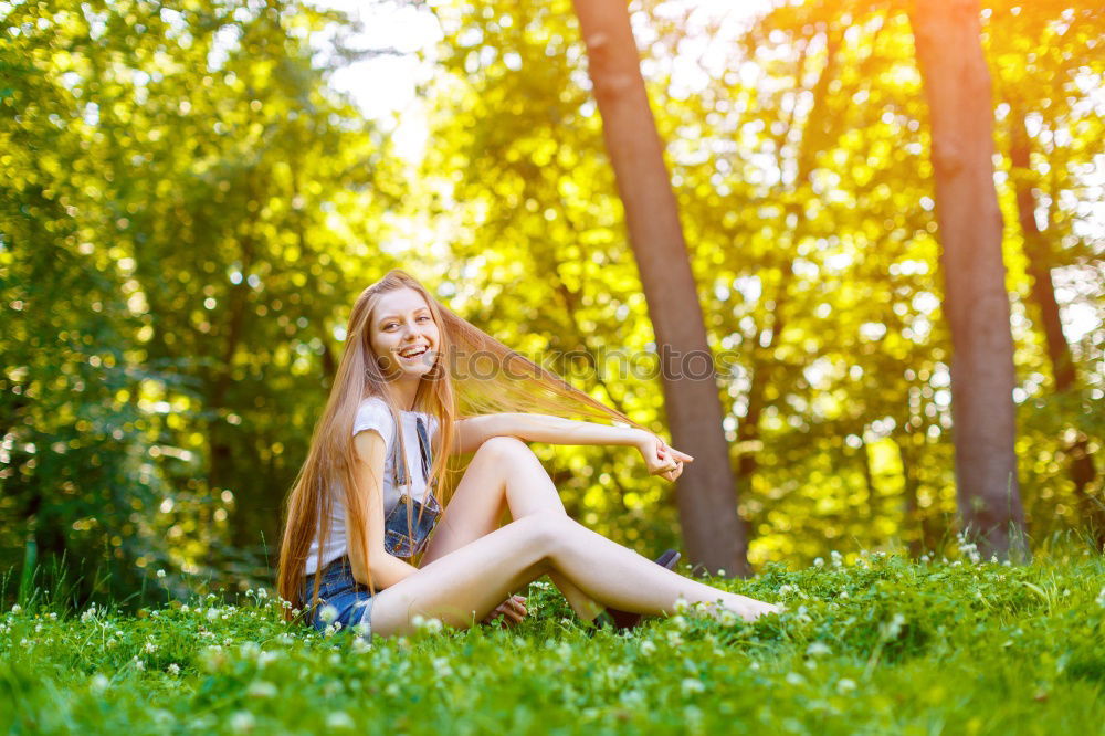 Similar – Woman with dreads sitting on a meadow