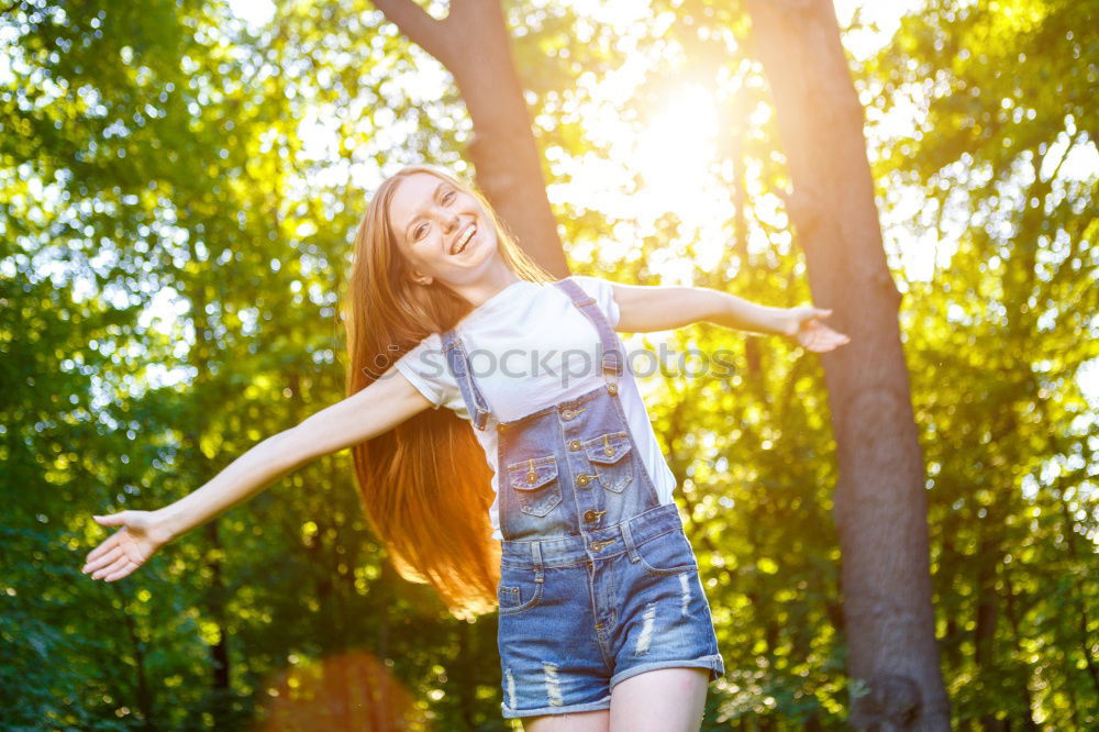 Similar – Young woman leaning on bridge railing