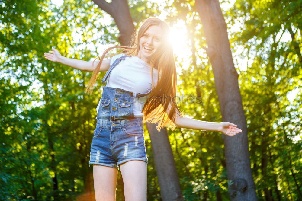 Similar – Young woman leaning on bridge railing