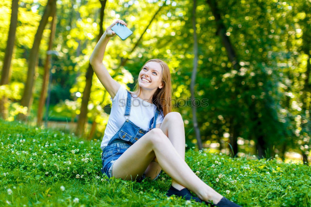 Similar – Image, Stock Photo Smiling young woman using a camera to take photo.