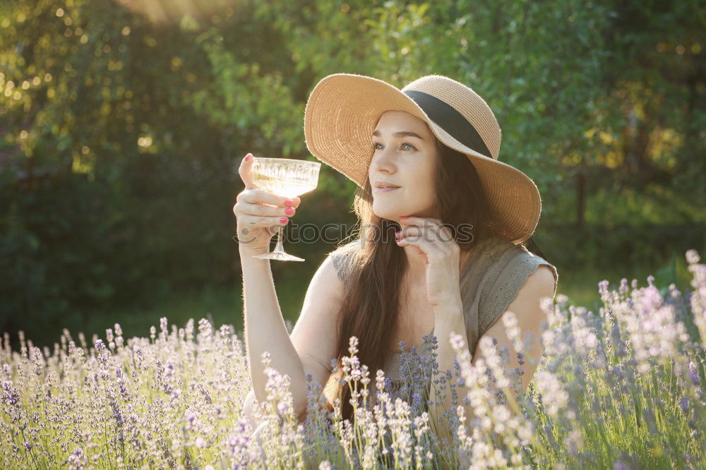 Similar – Young black woman eating a grape in a vineyard