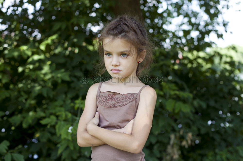 Similar – sad little girl holding toy with her hands