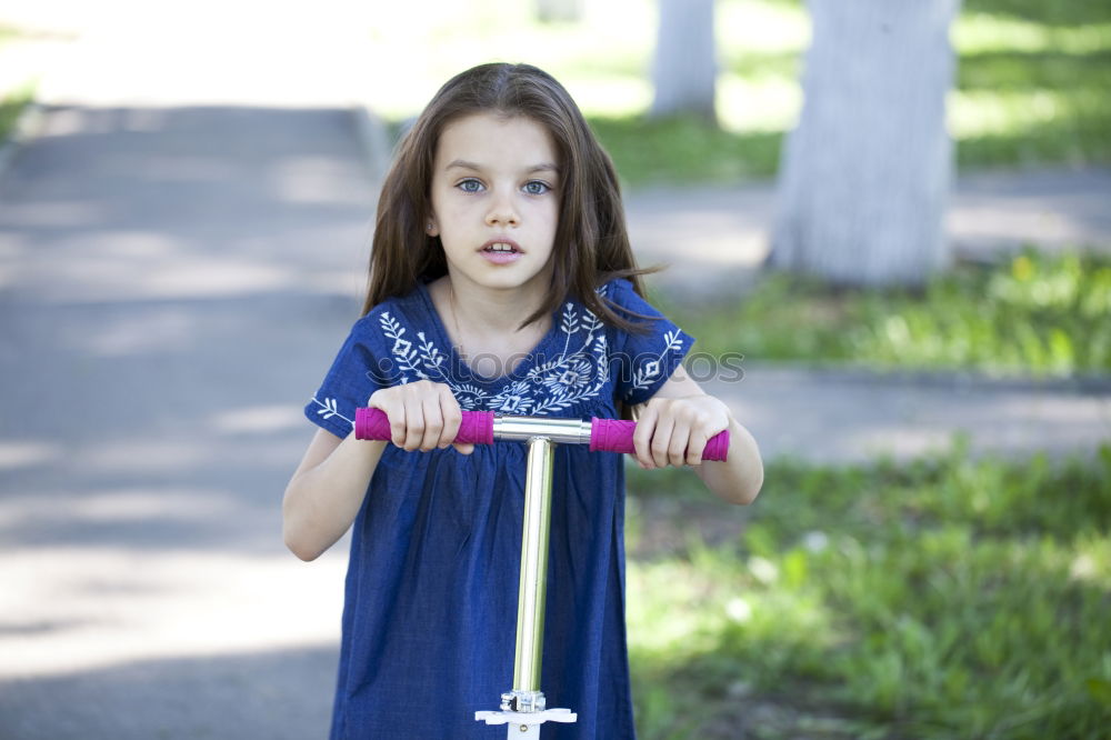 Similar – Cute girl driving bicycle in summer